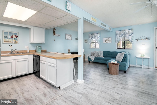 715 142nd St Unit 42304, Ocean City, MD 21842 - kitchen with white cabinetry, open floor plan, a sink, ceiling fan, and black dishwasher
