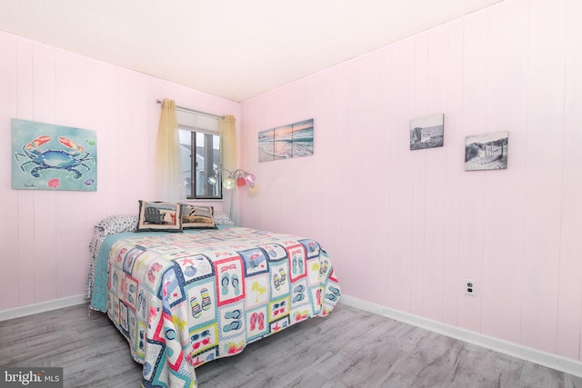 bedroom with hardwood / wood-style floors