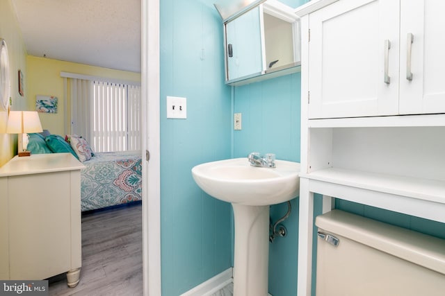 715 142nd St Unit 42304, Ocean City, MD 21842 - bathroom featuring a textured ceiling and wood finished floors