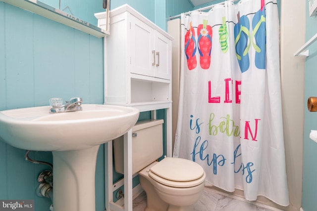 715 142nd St Unit 42304, Ocean City, MD 21842 - full bathroom featuring marble finish floor, toilet, a sink, and a shower with shower curtain