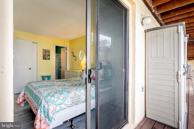 bedroom with wood-type flooring