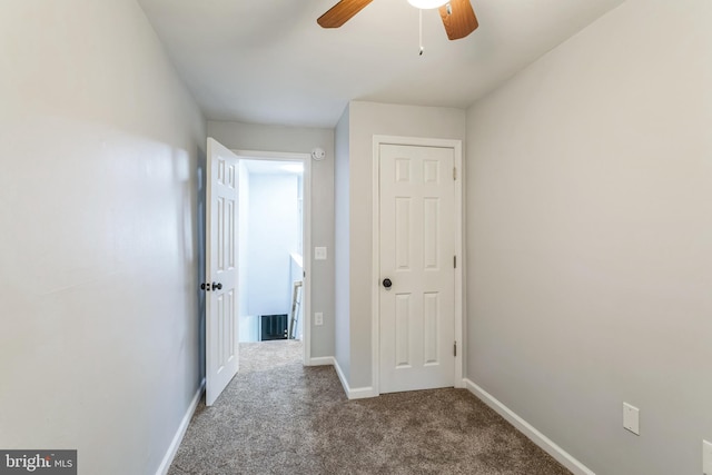 hallway with carpet flooring