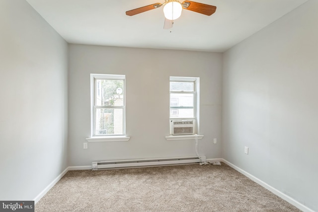 carpeted empty room with cooling unit, ceiling fan, a baseboard radiator, and a wealth of natural light