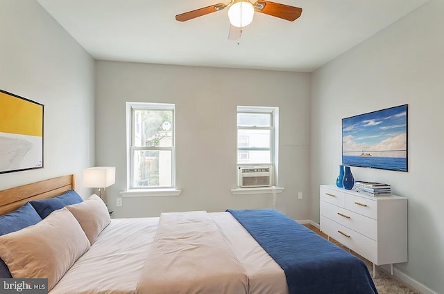 carpeted bedroom featuring cooling unit and ceiling fan