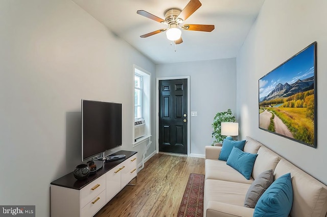 living room with hardwood / wood-style flooring and ceiling fan