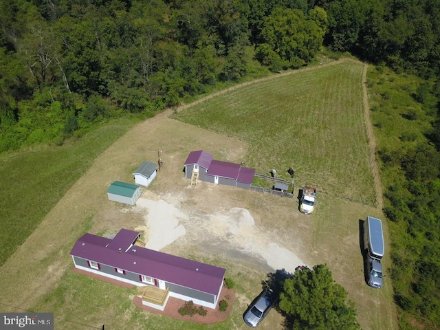 birds eye view of property featuring a rural view