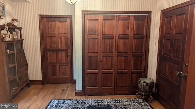 foyer entrance with light hardwood / wood-style floors