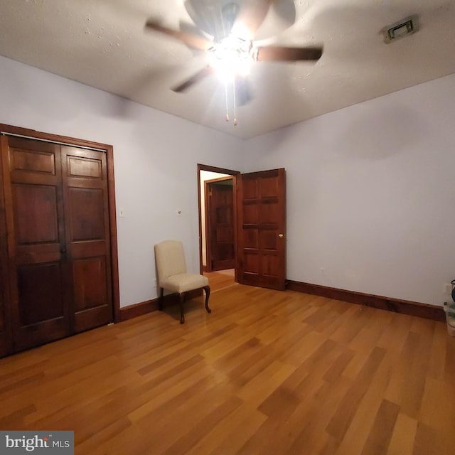 interior space with ceiling fan and light hardwood / wood-style flooring