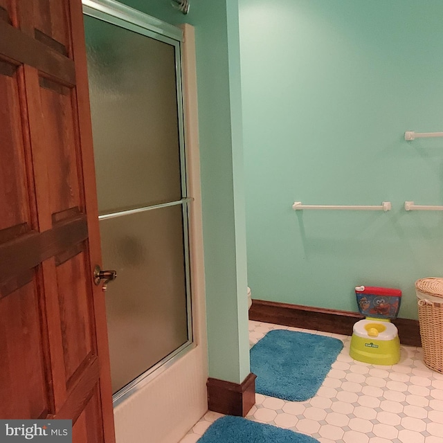 bathroom featuring enclosed tub / shower combo