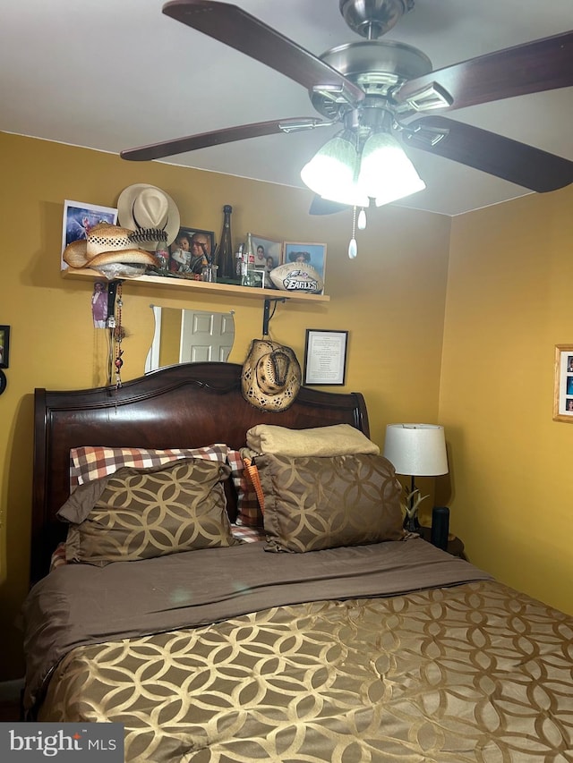 bedroom with ceiling fan and carpet