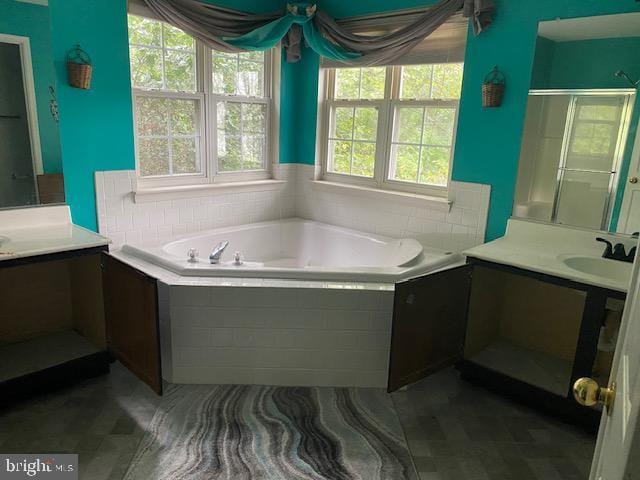 3004 Eider Ct, Waldorf, MD 20601 - bathroom featuring a garden tub, two vanities, and a shower stall