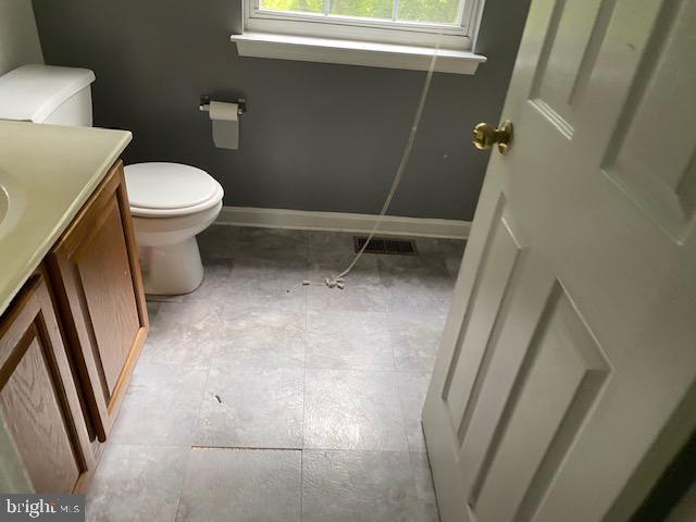 bathroom with vanity and toilet