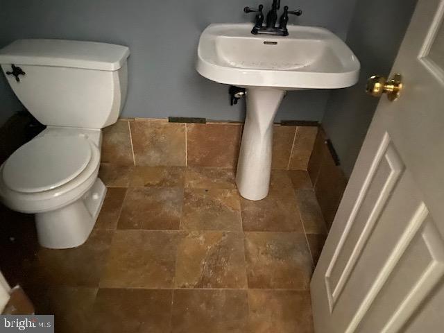 3004 Eider Ct, Waldorf, MD 20601 - half bath featuring toilet and stone finish flooring