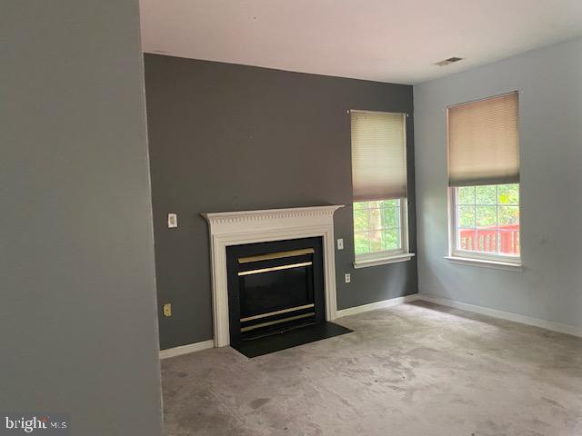 3004 Eider Ct, Waldorf, MD 20601 - unfurnished living room with a fireplace with flush hearth and baseboards
