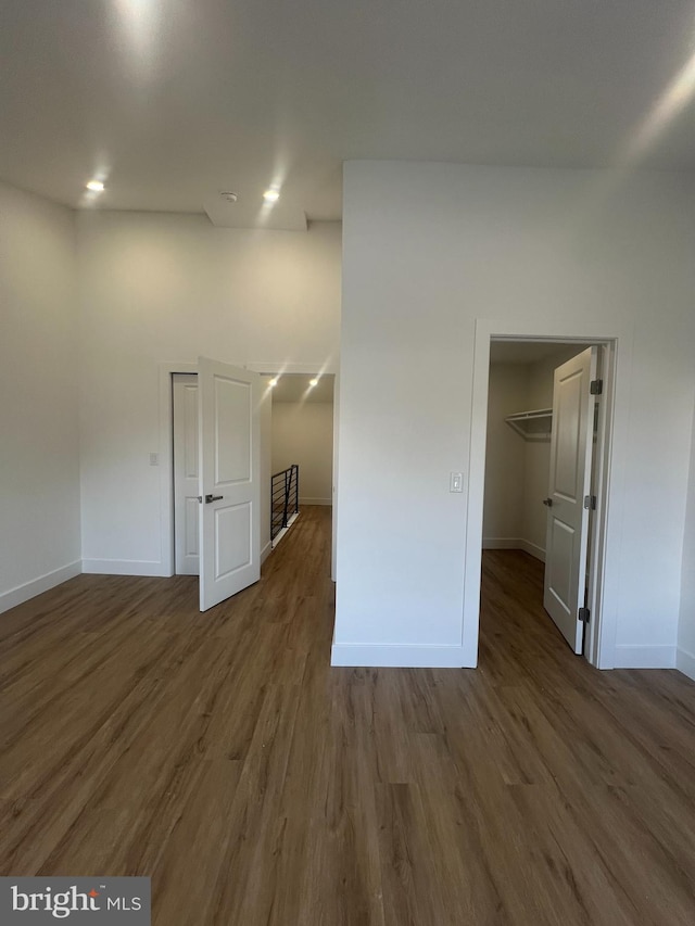 empty room featuring dark hardwood / wood-style flooring