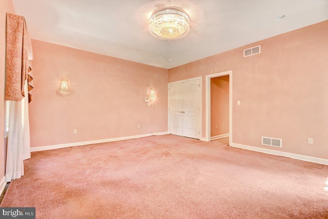 unfurnished room featuring carpet floors