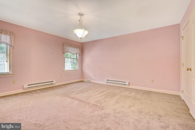 empty room with baseboard heating and carpet flooring