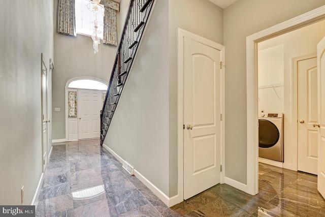 interior space featuring washer / clothes dryer and plenty of natural light