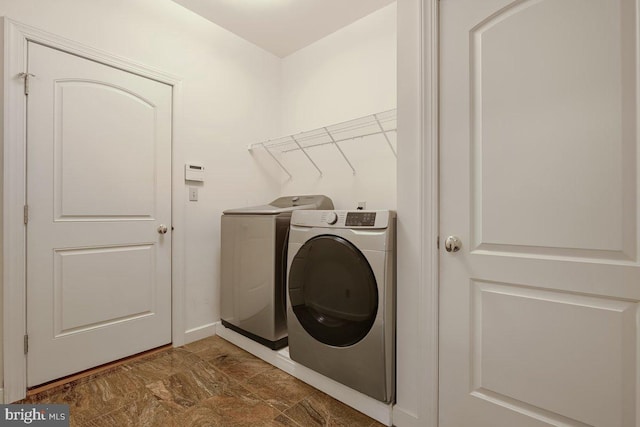 laundry area with washing machine and dryer