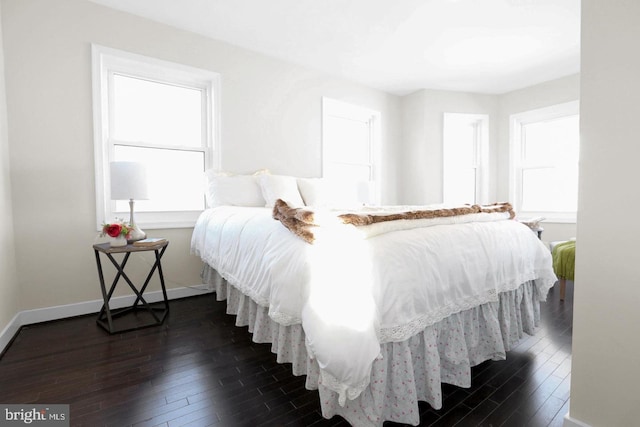 bedroom featuring dark hardwood / wood-style flooring