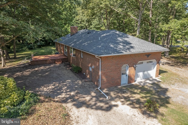 view of side of property with a garage