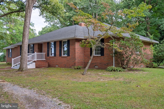 ranch-style home with a front lawn