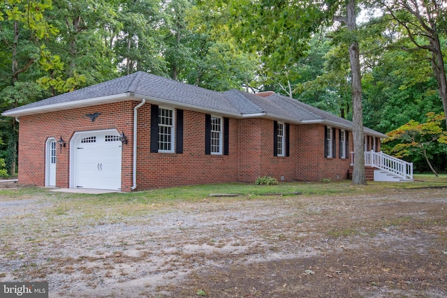 single story home featuring a garage