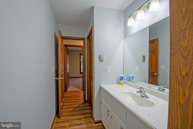 bathroom featuring vanity and hardwood / wood-style floors