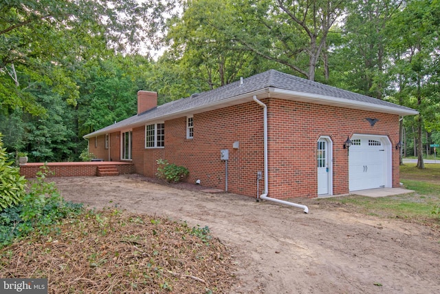 view of property exterior with a garage