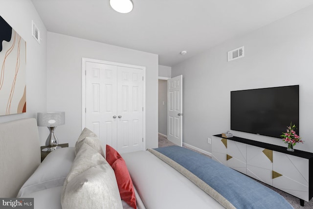 carpeted bedroom featuring a closet