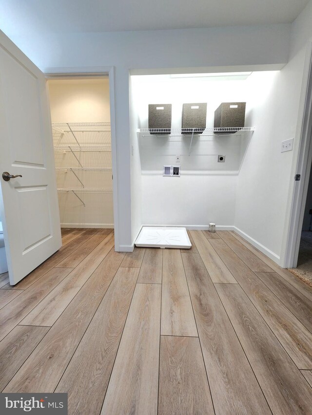 bathroom with wood-type flooring and toilet