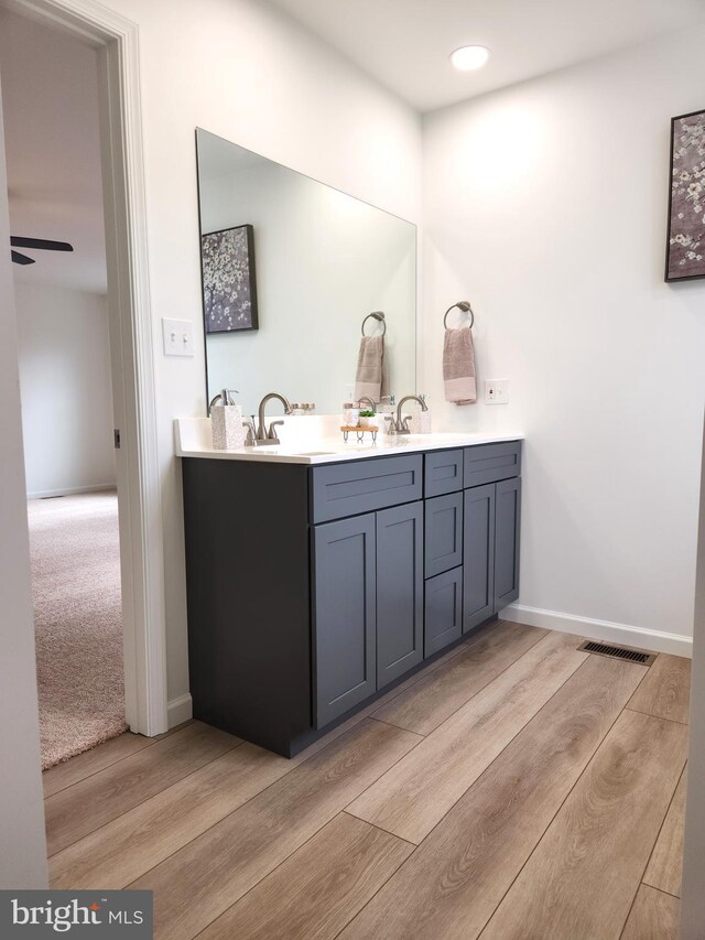 unfurnished bedroom featuring ceiling fan and light colored carpet