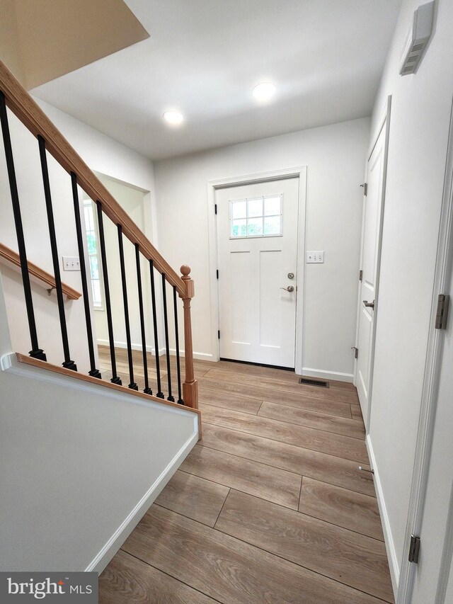 entryway with light hardwood / wood-style flooring