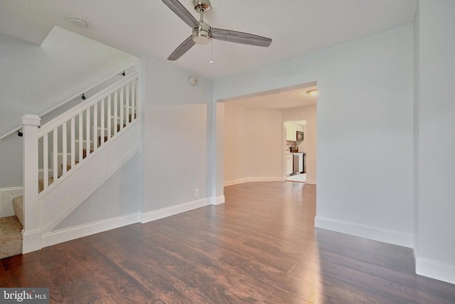 interior space featuring ceiling fan and dark hardwood / wood-style floors