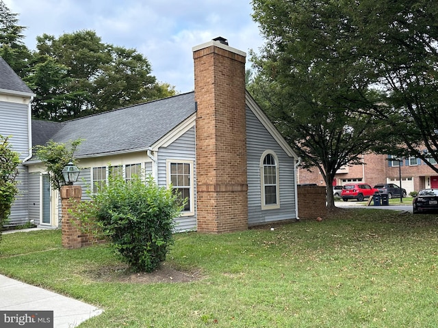 view of home's exterior featuring a yard