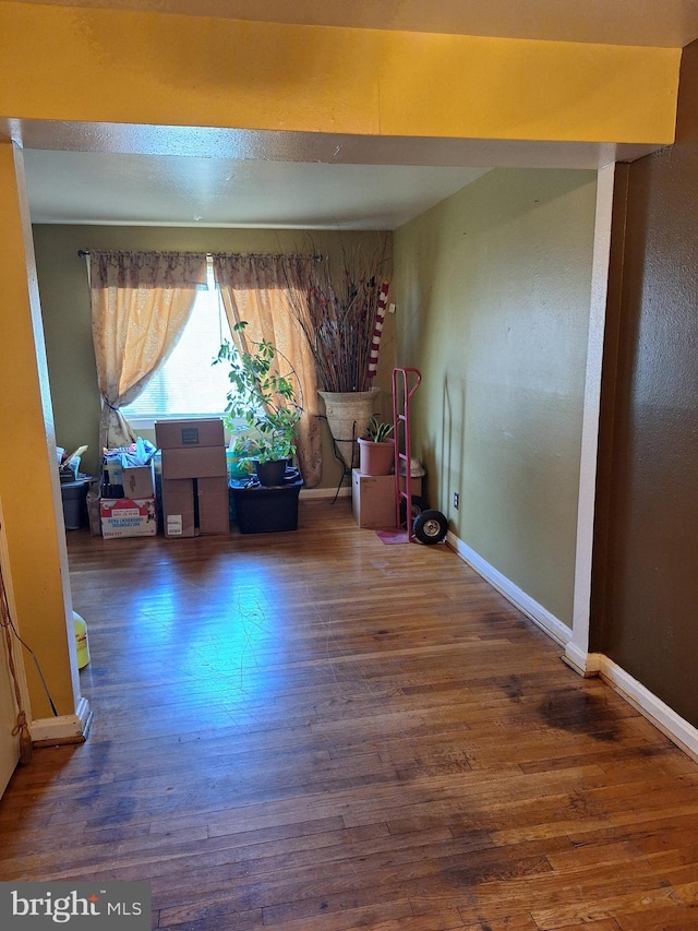 unfurnished room featuring dark hardwood / wood-style floors