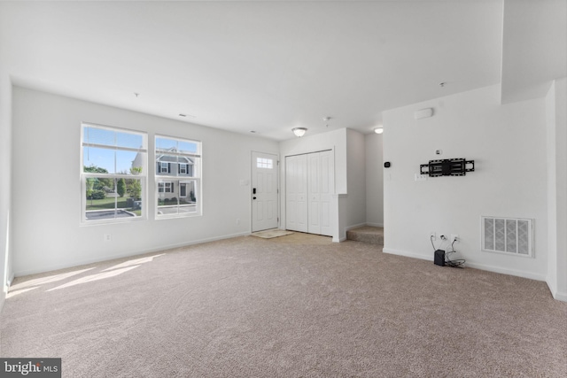 9 Azalea Cir, Elkton, MD 21921 - unfurnished living room featuring baseboards, visible vents, and light carpet