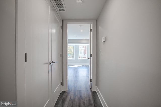 hall with dark hardwood / wood-style flooring