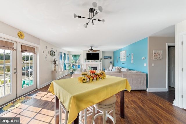 dining area featuring french doors, ceiling fan, and dark hardwood / wood-style floors