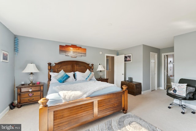 bedroom featuring light colored carpet