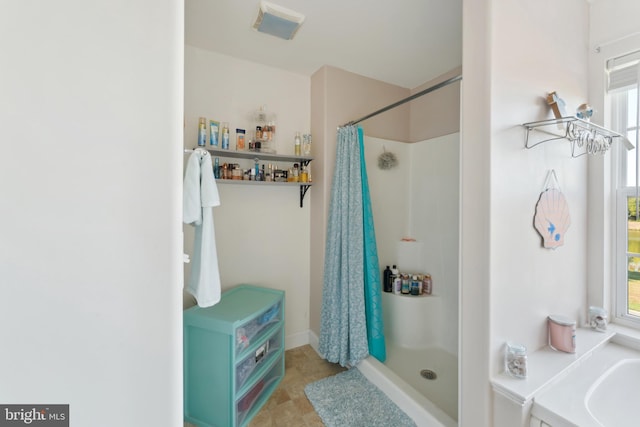 bathroom with curtained shower