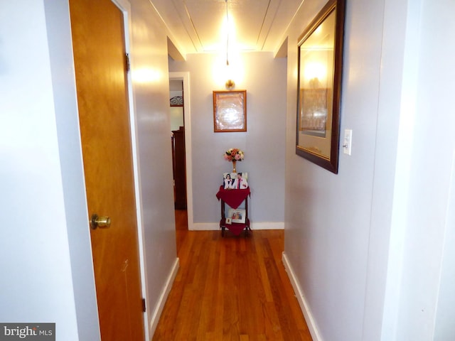 corridor featuring dark hardwood / wood-style floors