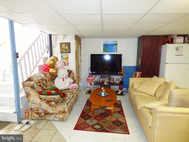 living room with a drop ceiling