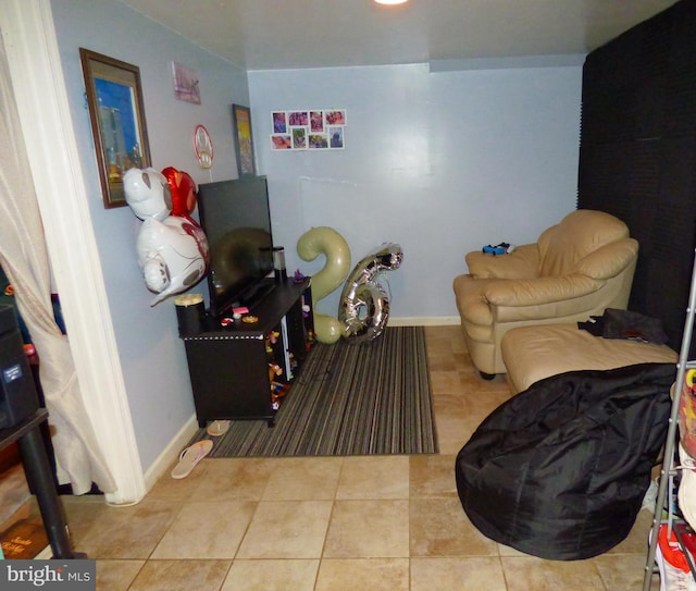 sitting room featuring light tile patterned floors