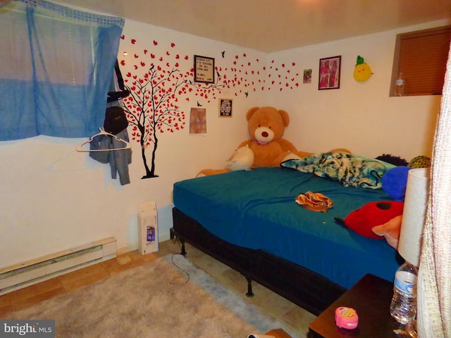 bedroom featuring a baseboard heating unit