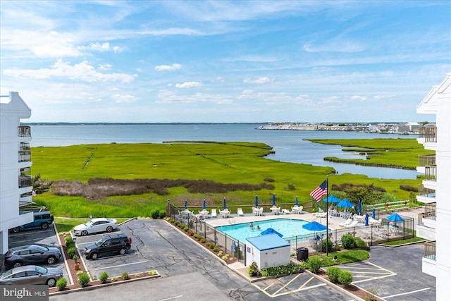 birds eye view of property with a water view