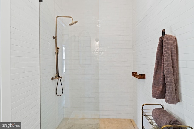 bathroom with tiled shower