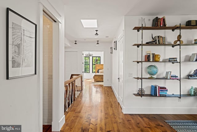 hallway featuring hardwood / wood-style flooring