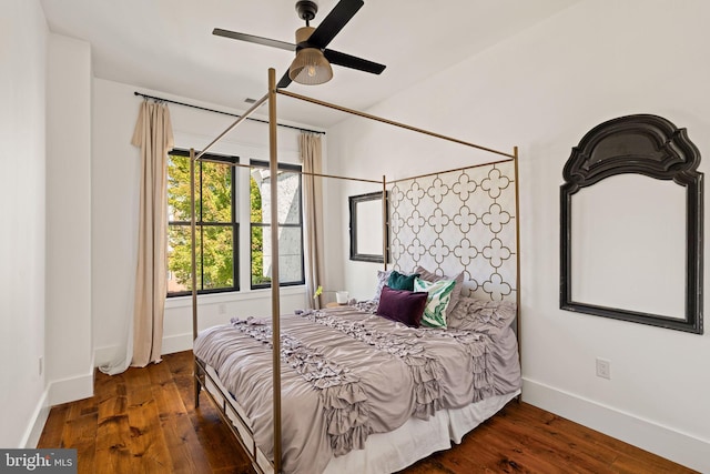 bedroom featuring ceiling fan and dark hardwood / wood-style flooring