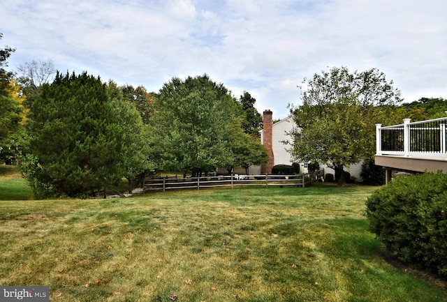 view of yard featuring a wooden deck